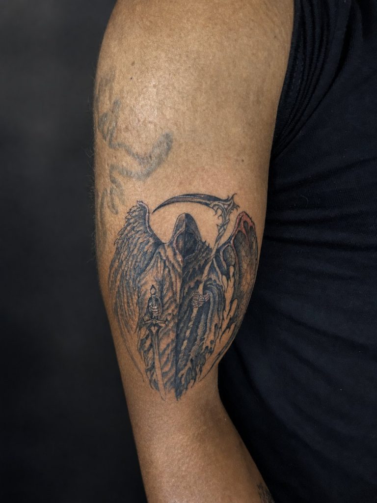 Black and grey tattoo by Woke Tattoo Studio