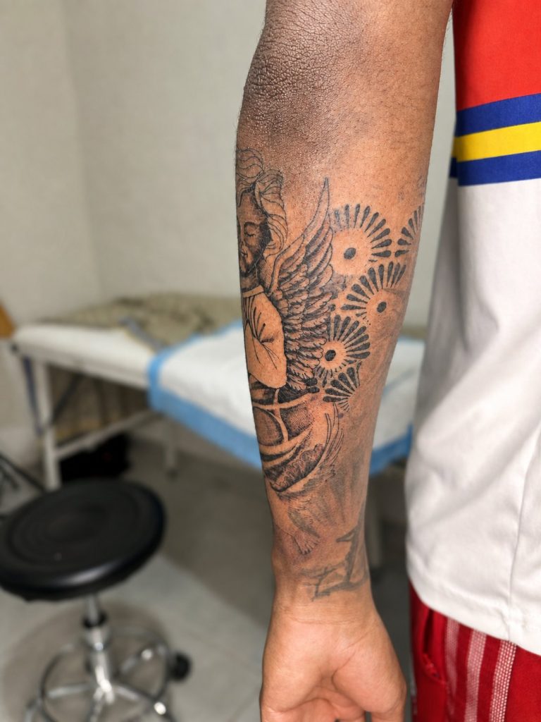Black and grey tattoo by Woke Tattoo Studio