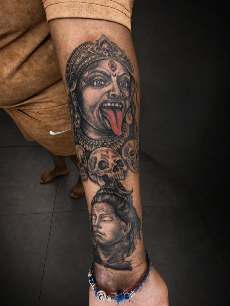 Black and grey portrait sleeve tattoo on the forearm