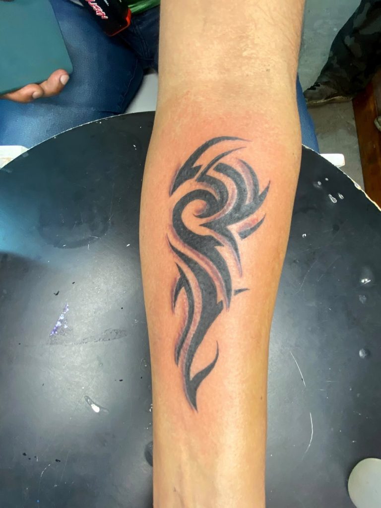 Custom tattoo by Woke Tattoo Studio