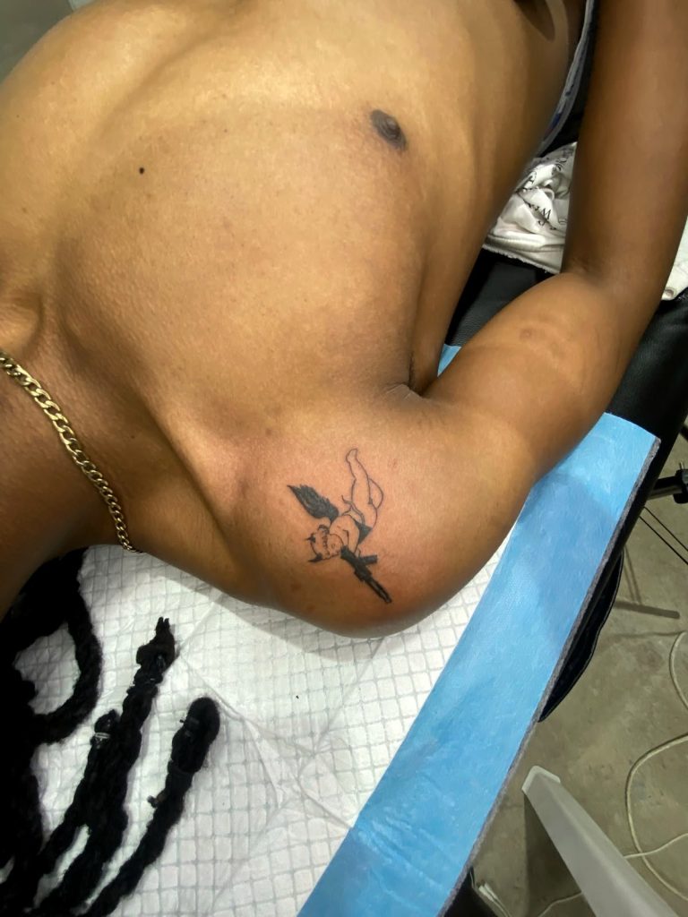Fine line tattoo by Woke Tattoo Studio in Randburg