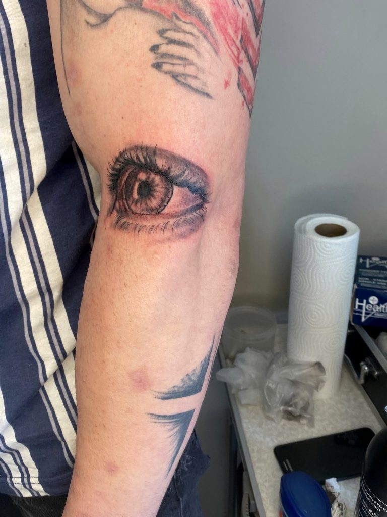 Black and grey tattoo by Woke Tattoo Studio