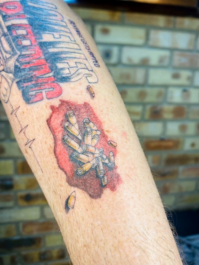 Colour cartoon tattoo on the forearm