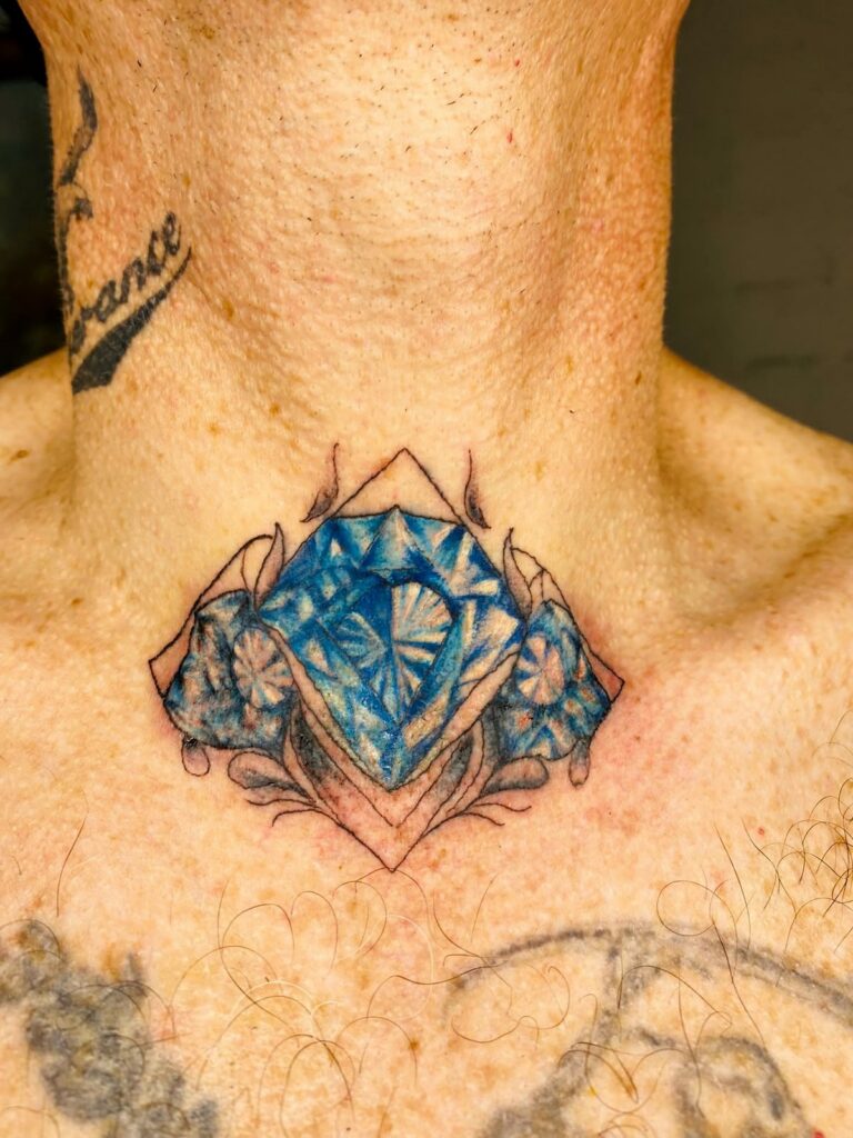 Blue diamond colour tattoo on the chest