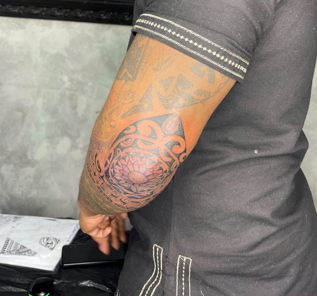 Black and grey tattoo by Woke Tattoo Studio
