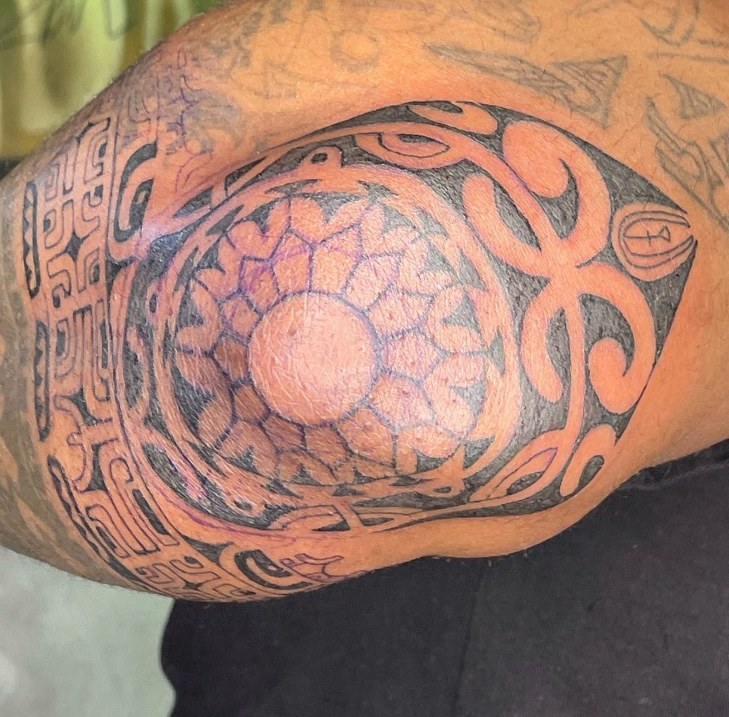 Black and grey tattoo by Woke Tattoo Studio