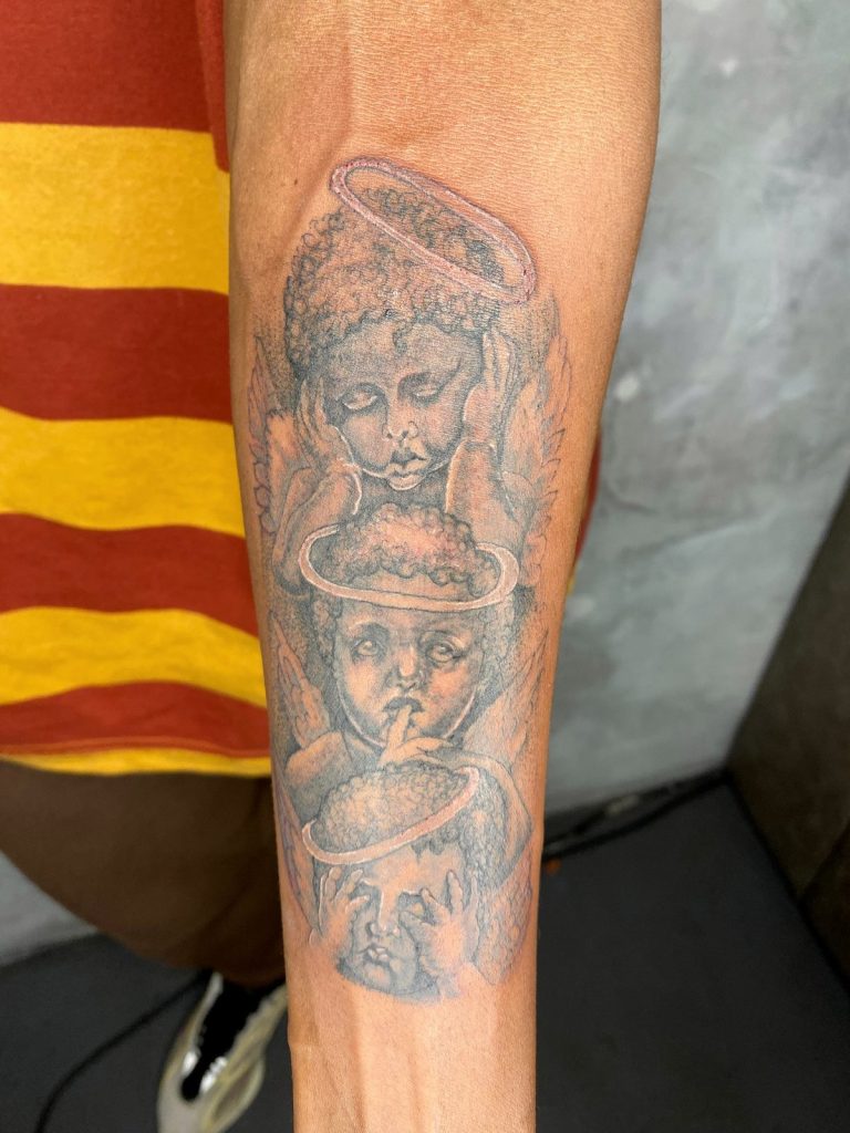 Black and grey tattoo by Woke Tattoo Studio