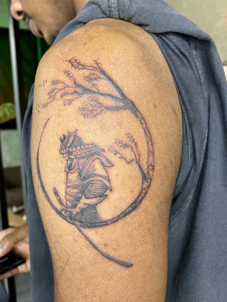 Black and grey tattoo by Woke Tattoo Studio