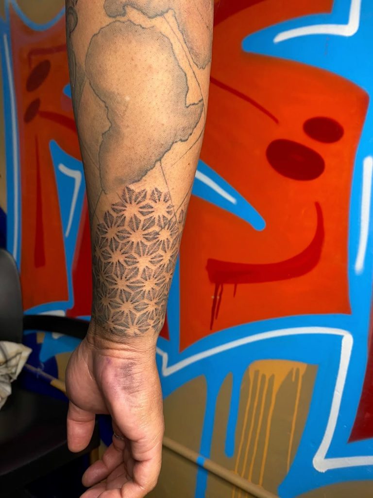 Black and grey tattoo by Woke Tattoo Studio