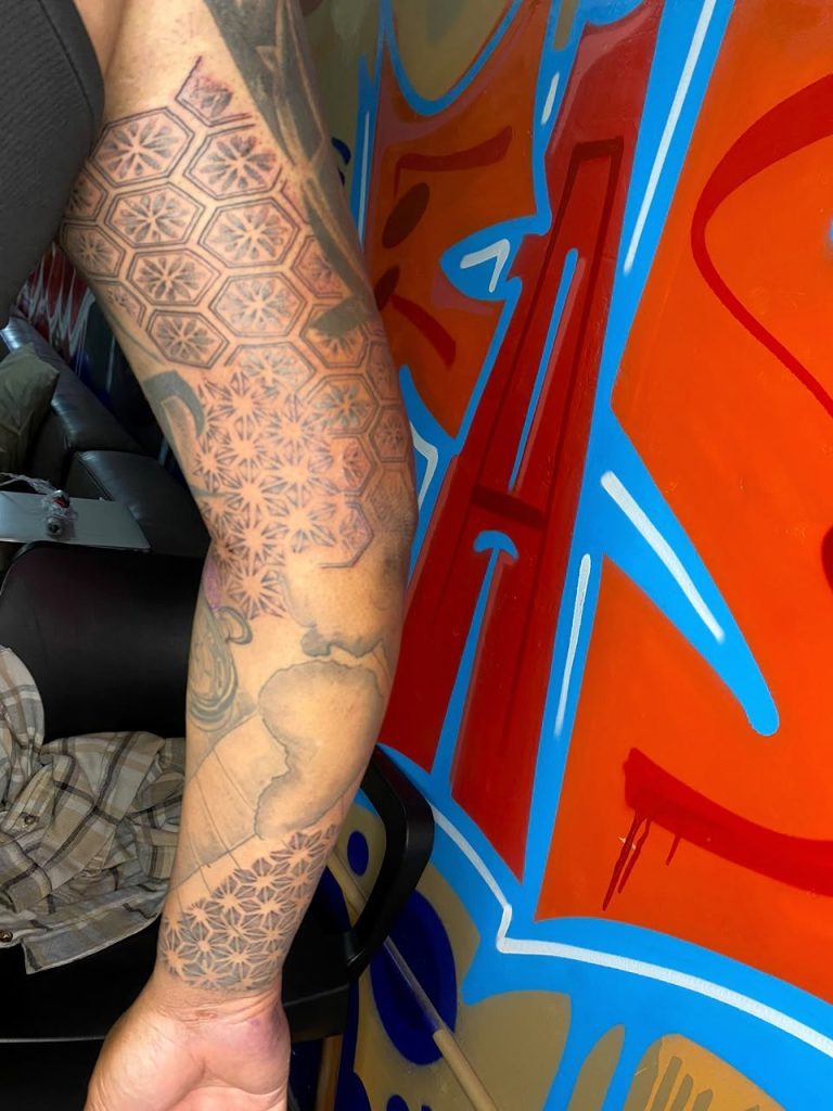 Black and grey tattoo by Woke Tattoo Studio
