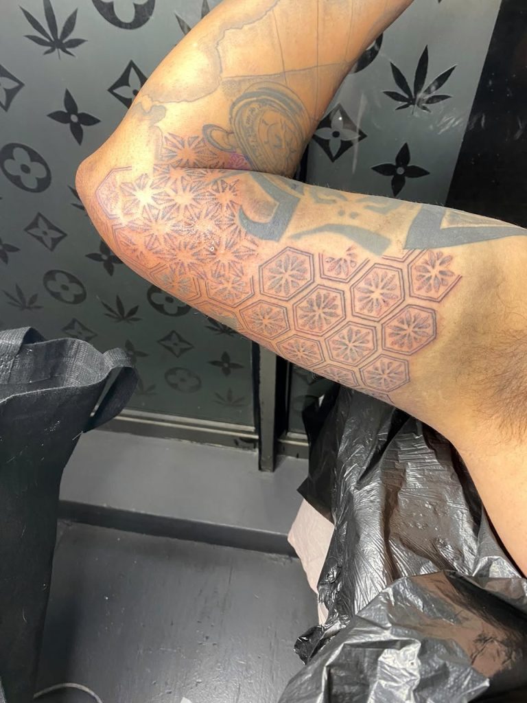 Black and grey tattoo by Woke Tattoo Studio