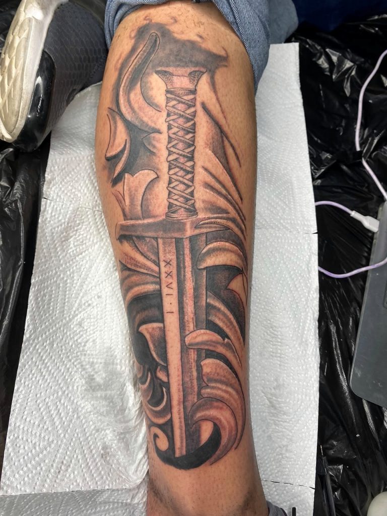 Black and grey tattoo by Woke Tattoo Studio