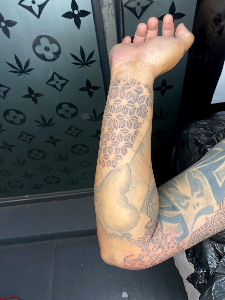 Black and grey tattoo by Woke Tattoo Studio