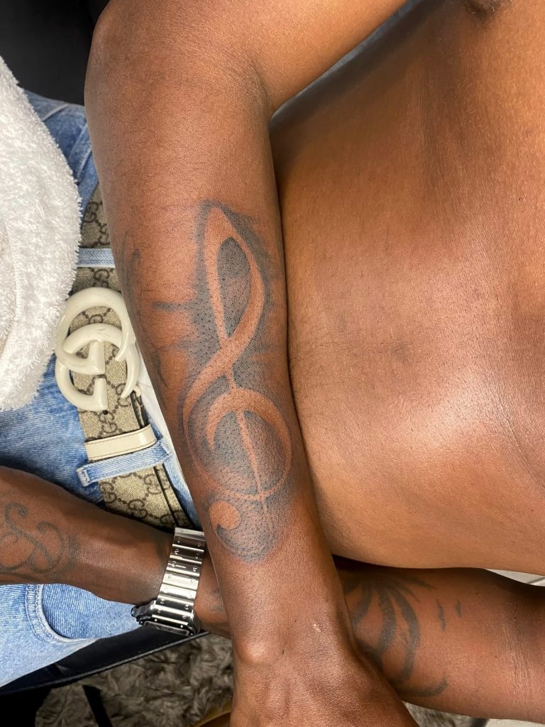 Black and grey tattoo by Woke Tattoo Studio