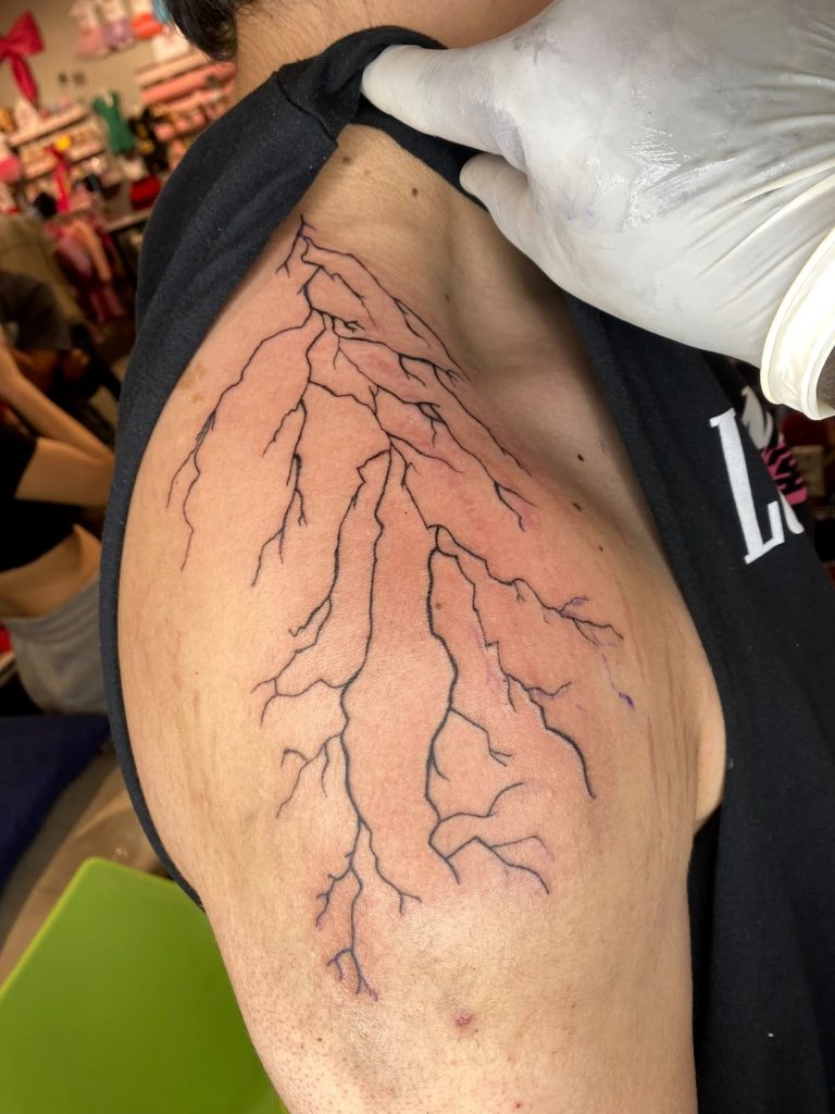 Fine line tattoo by Woke Tattoo Studio in Randburg