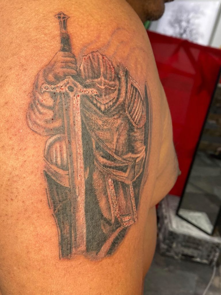 Black and grey tattoo by Woke Tattoo Studio