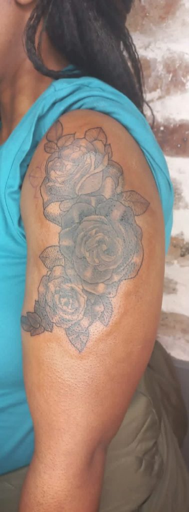 Black and grey tattoo by Woke Tattoo Studio