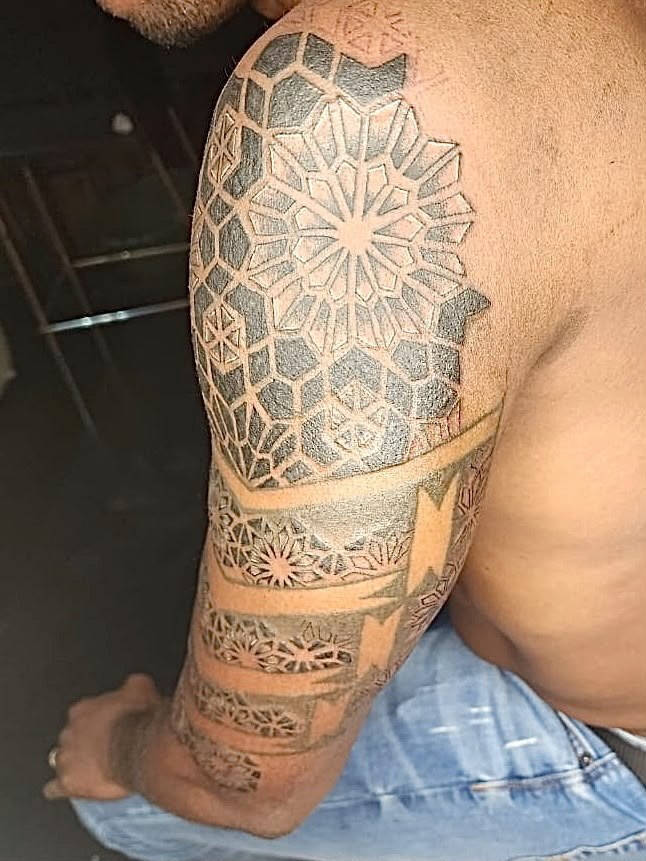 Black and grey tattoo by Woke Tattoo Studio