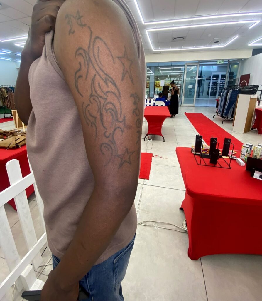 Outline tattoo design on the upper arm before completion
