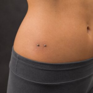 Hip surface piercing