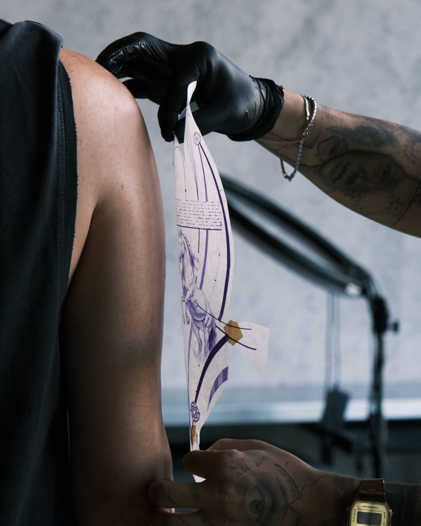 Tattoo stencil placement during a private consultation